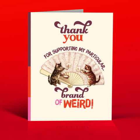 Vintage style greeting card. Cats play next to an old victorian fan. The text is, "Thank you for supporting my particular brand of weird."