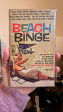 a book called Beach Binge. A blond woman lays on a beach.