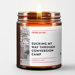 A candle called Sucking My Way Through Conversion Camp.